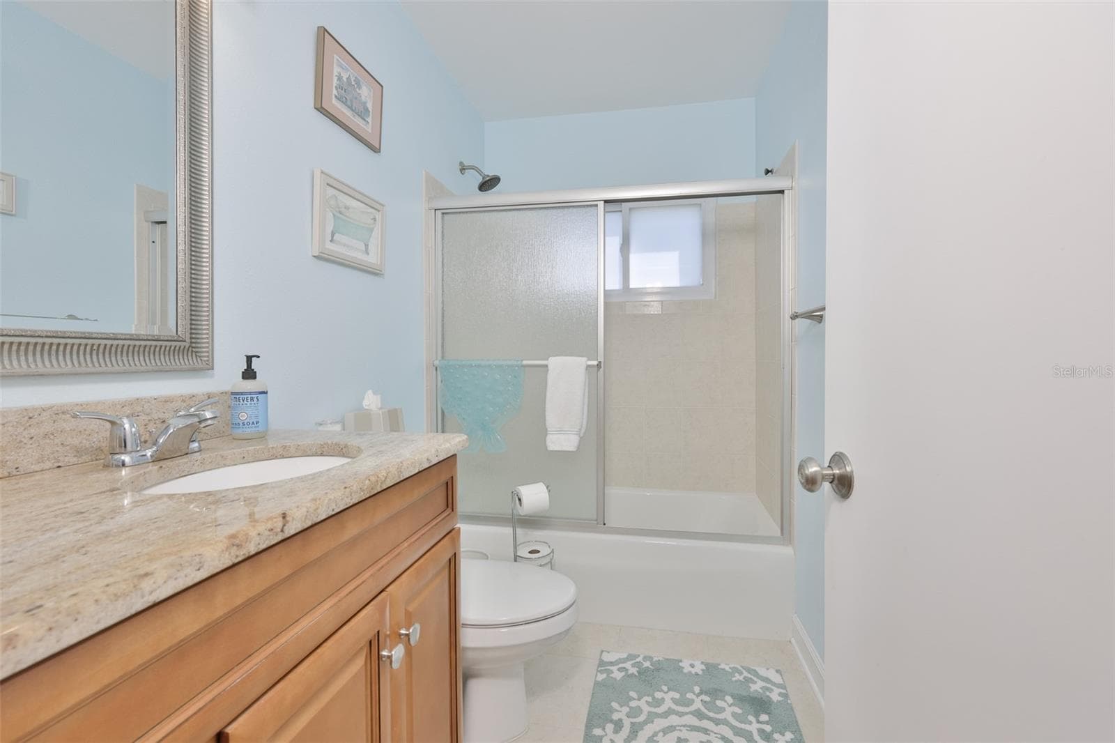 Primary Bath, Wood High Top Vanity & Exquisite Granite Countertop, Updated Mirror & Fixtures, Tub/Shower - 1704 DANBURY DR, SUN CITY CENTER