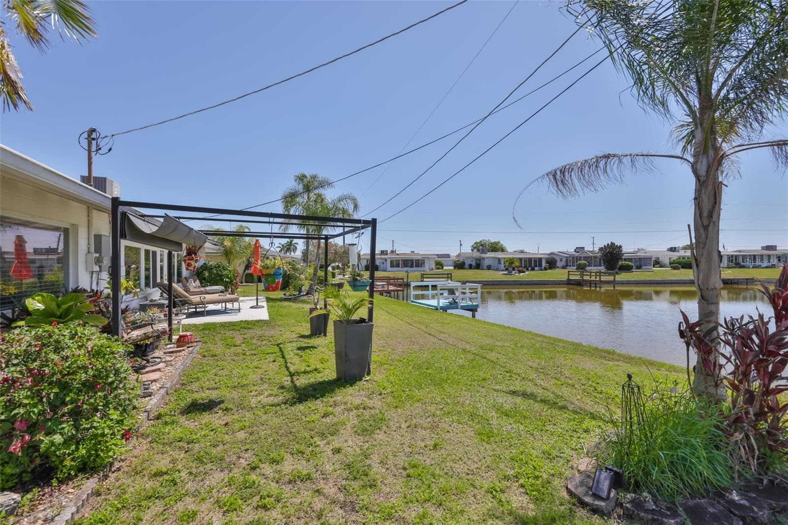 Rear Patio, Perfect for Sunbathing or Watching Wildlife, Metal Gazebo for Outdoor Dining, Irrigation from Lake - 1704 DANBURY DR, SUN CITY CENTER