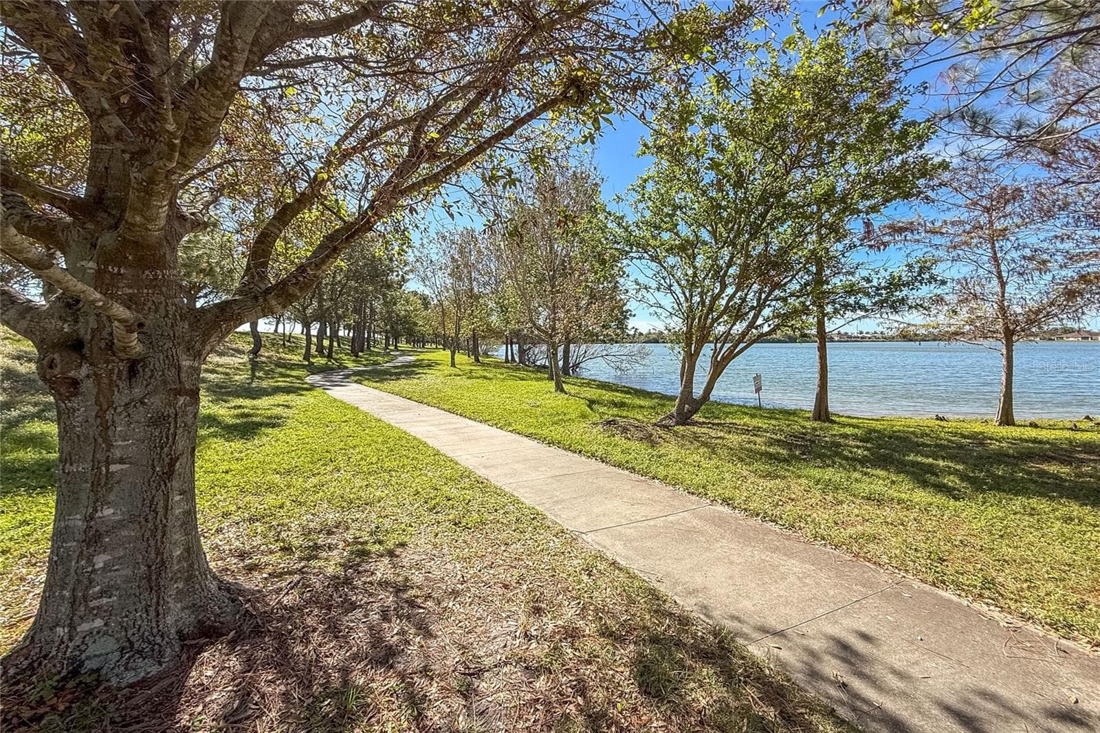 Walking path around lake - 8834 TUSCANY ISLES DR, PUNTA GORDA
