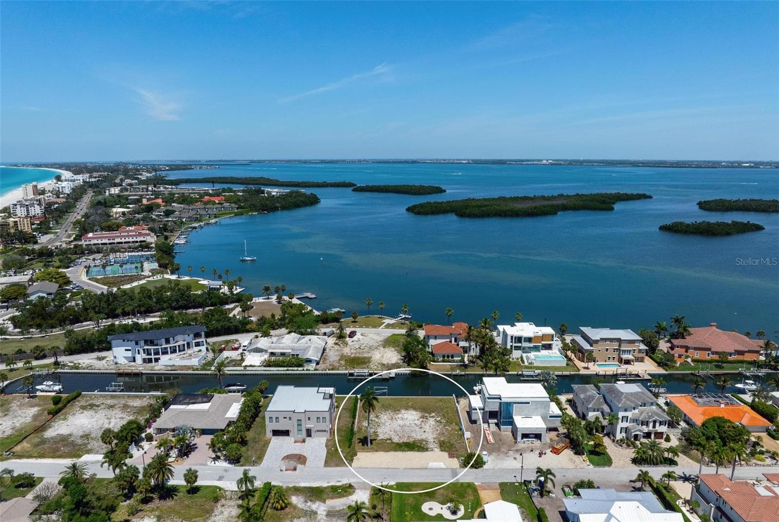Higher drone view of vacant lot with view of Longboat Key beach to top left. - 581 ROUNTREE DR, LONGBOAT KEY