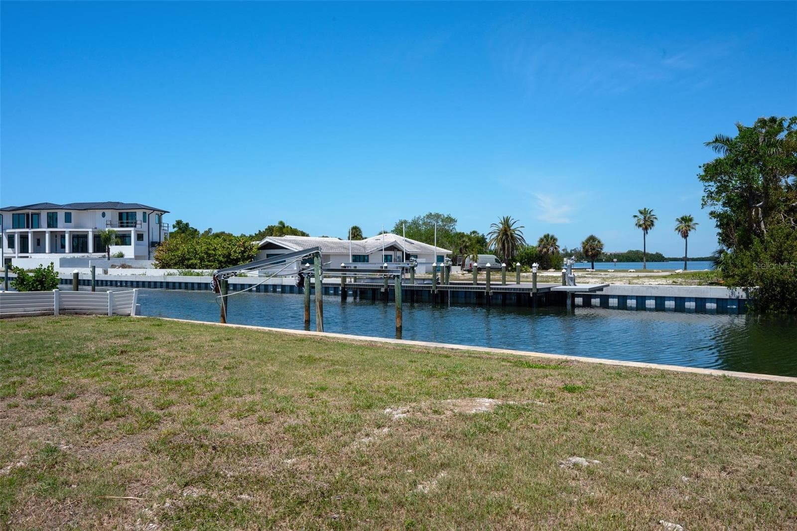 View from vacant lot to deep water canal and Sarasota Bay in the distance. - 581 ROUNTREE DR, LONGBOAT KEY