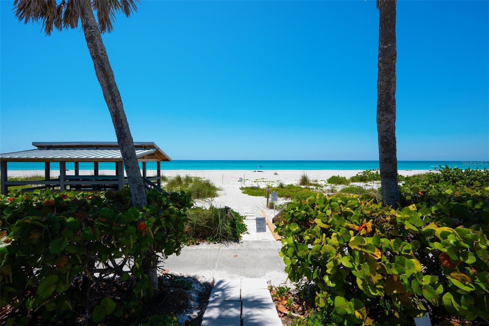 Close-up of private beach entrance. - 581 ROUNTREE DR, LONGBOAT KEY