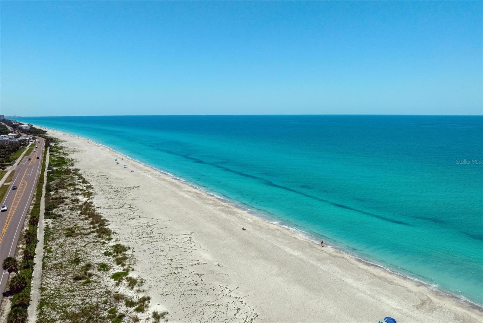 Drone view of beach looking south down the beach. - 581 ROUNTREE DR, LONGBOAT KEY