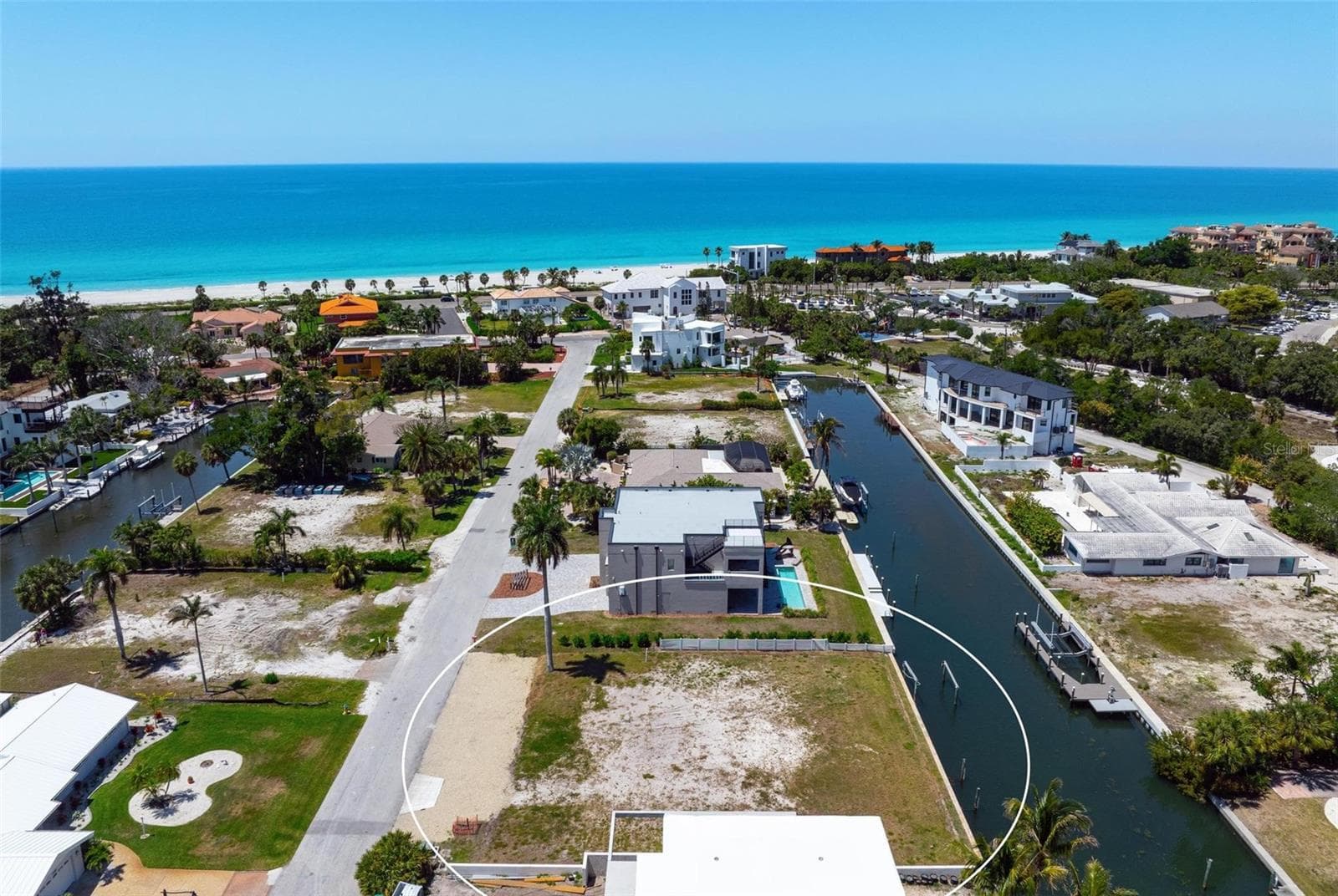 Drone view of vacant lot looking west - 581 ROUNTREE DR, LONGBOAT KEY