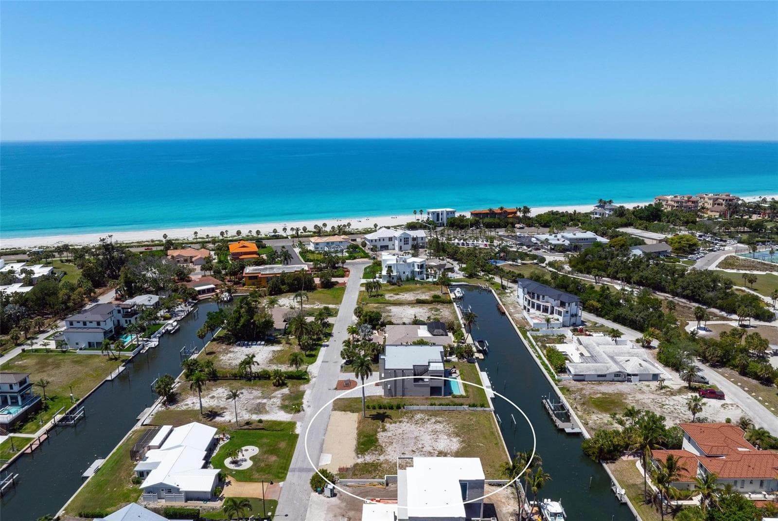 Drone view showing canals on each street in Longboat Key Estates. - 581 ROUNTREE DR, LONGBOAT KEY