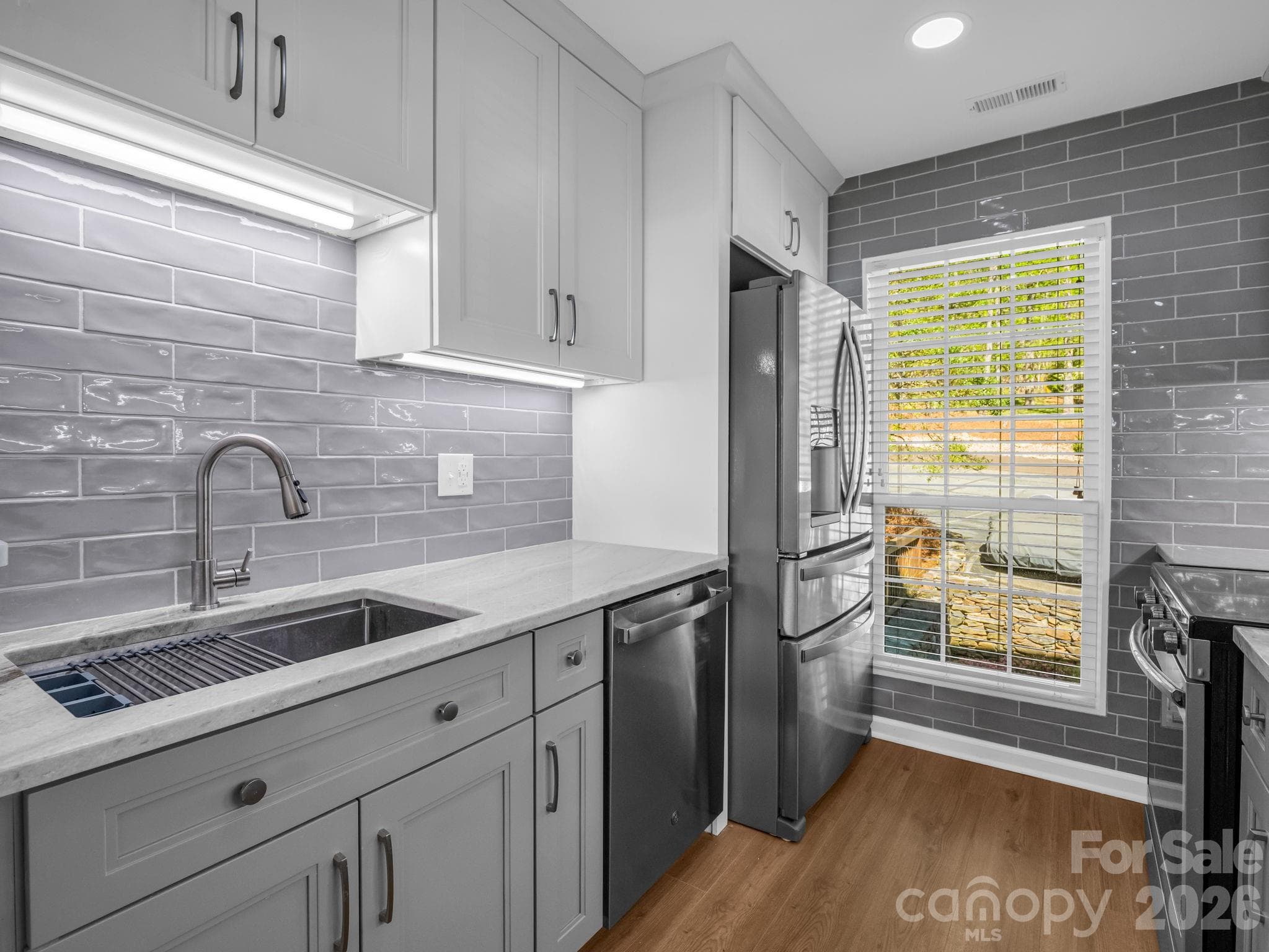 Tile backsplash and solid surface counters - 2881 White Oak Mountain Road, Columbus