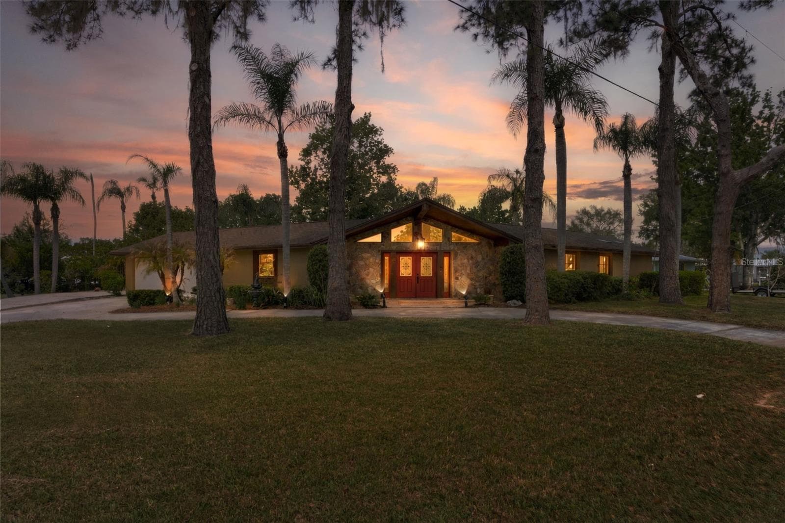 Front with lights - 239 SE PARADISE POINT RD, CRYSTAL RIVER