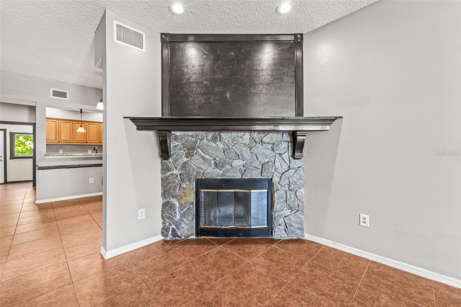 living room with a real wood burning fireplace - 312 WINCHESTER WAY, PALM HARBOR