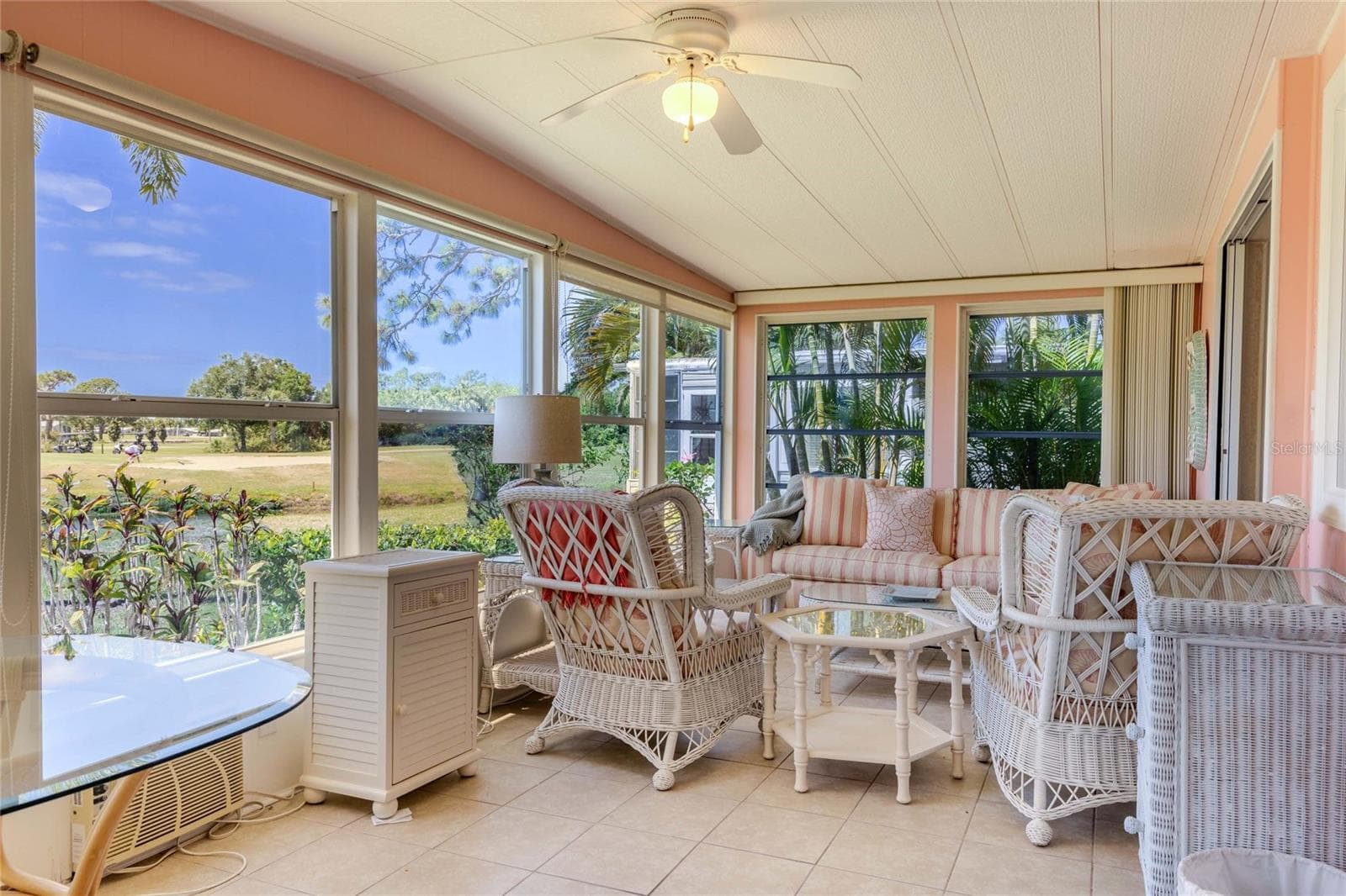 panoramic views of pond and golf course off back of home from inside lanai - 2100 KINGS HWY #497, PORT CHARLOTTE