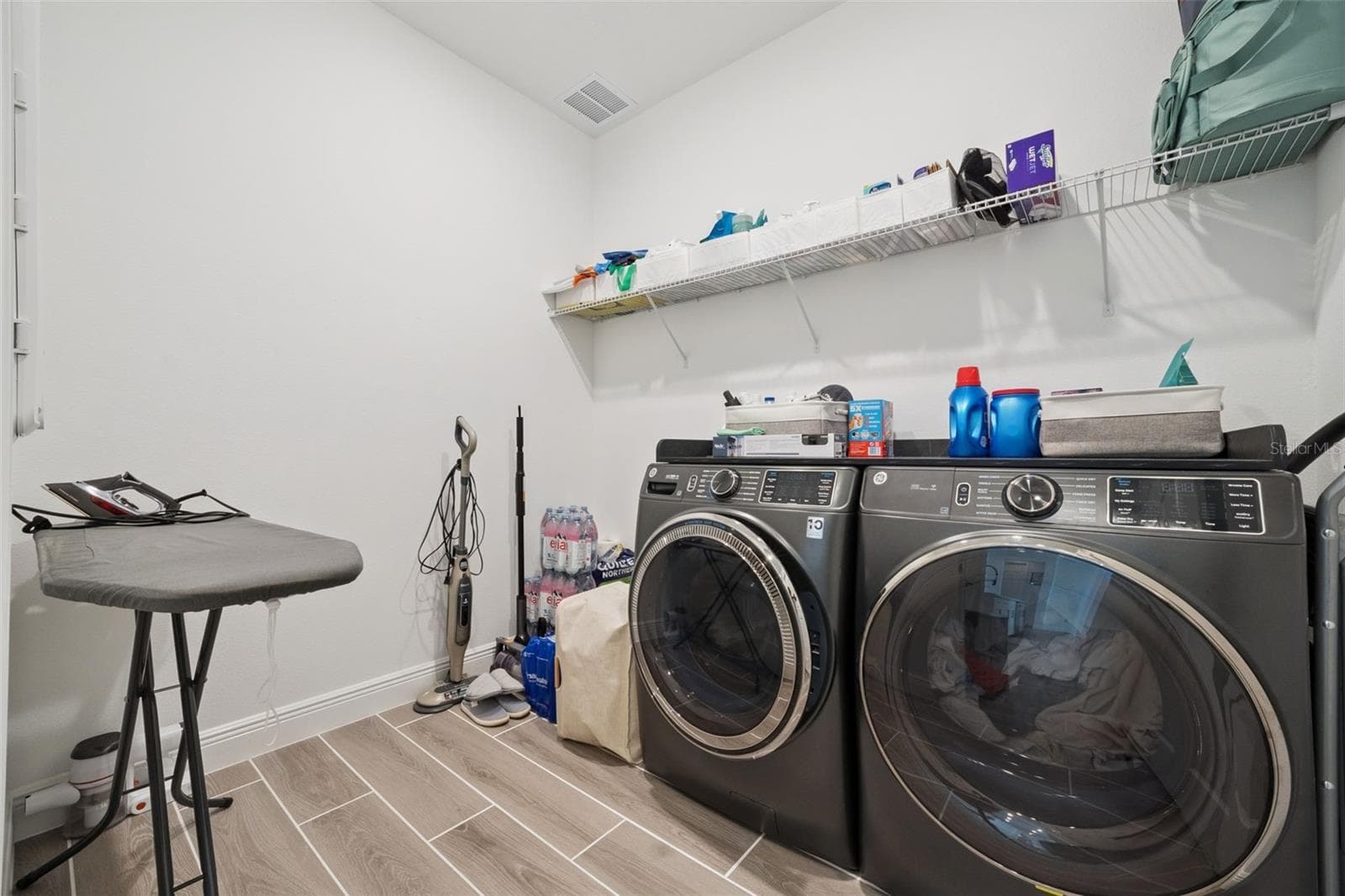 Large laundry room - 5897 SIERRA CROWN ST, MOUNT DORA