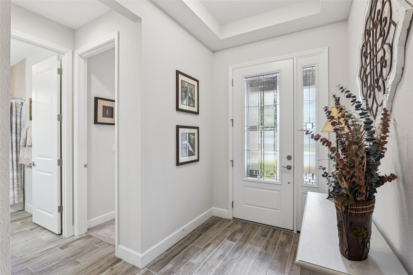 Lovely glass front door lets in abundant light - 1157 AVERY MEADOWS WAY, DELAND