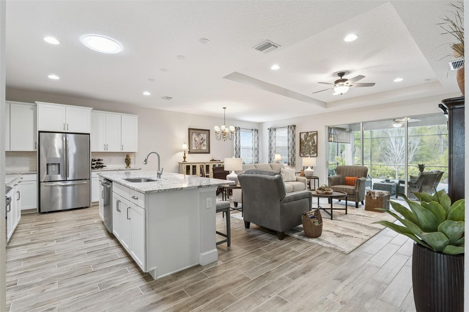Easy care, wood-look plank tile runs throughout your living areas - 1157 AVERY MEADOWS WAY, DELAND