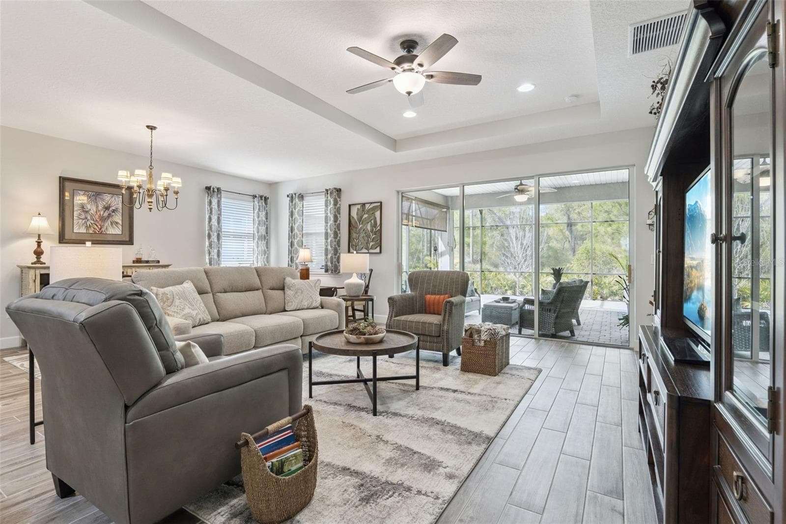 Spacious Great Room plan, wonderful for entertaining.Triple sliders take you out to the 26'x28' screened lanai, overlooking a wooded view - 1157 AVERY MEADOWS WAY, DELAND