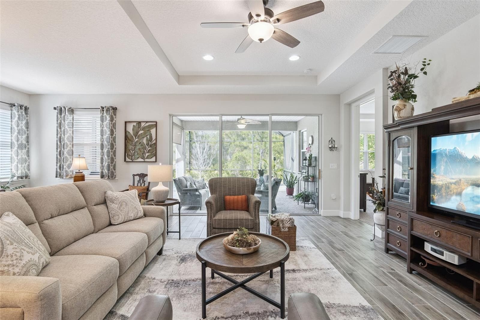 Triple sliders open to the oversized, expanded, screen Lanai - 1157 AVERY MEADOWS WAY, DELAND