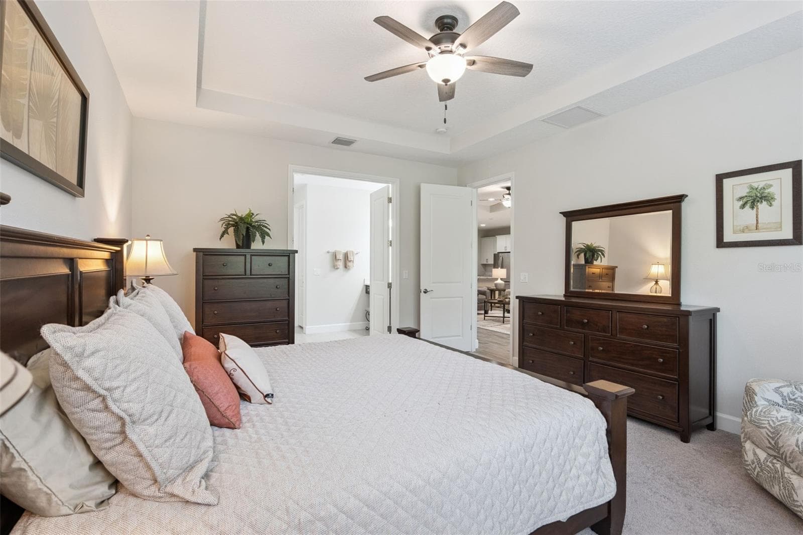 Alternate photo of the primary bedroom with coffered ceiling and fan - 1157 AVERY MEADOWS WAY, DELAND