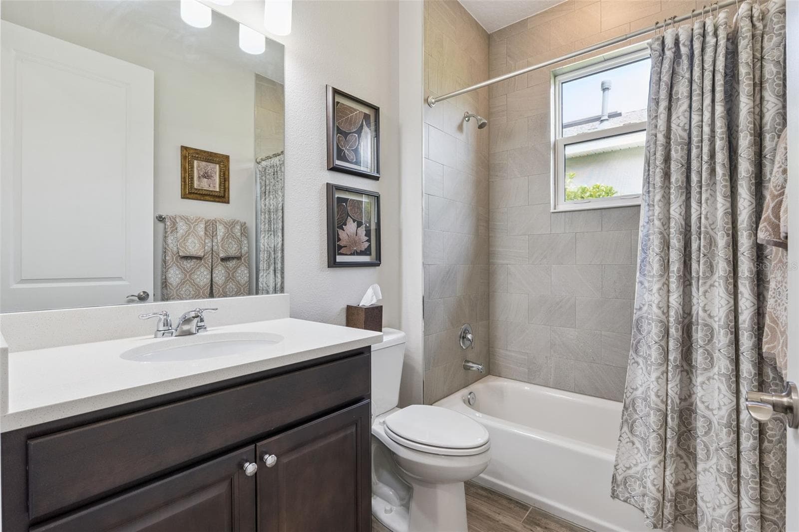 Guest bath located by the Guest Room - 1157 AVERY MEADOWS WAY, DELAND