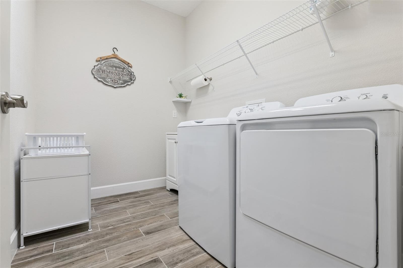 Large laundry room; washer and dryer remain with the home - 1157 AVERY MEADOWS WAY, DELAND