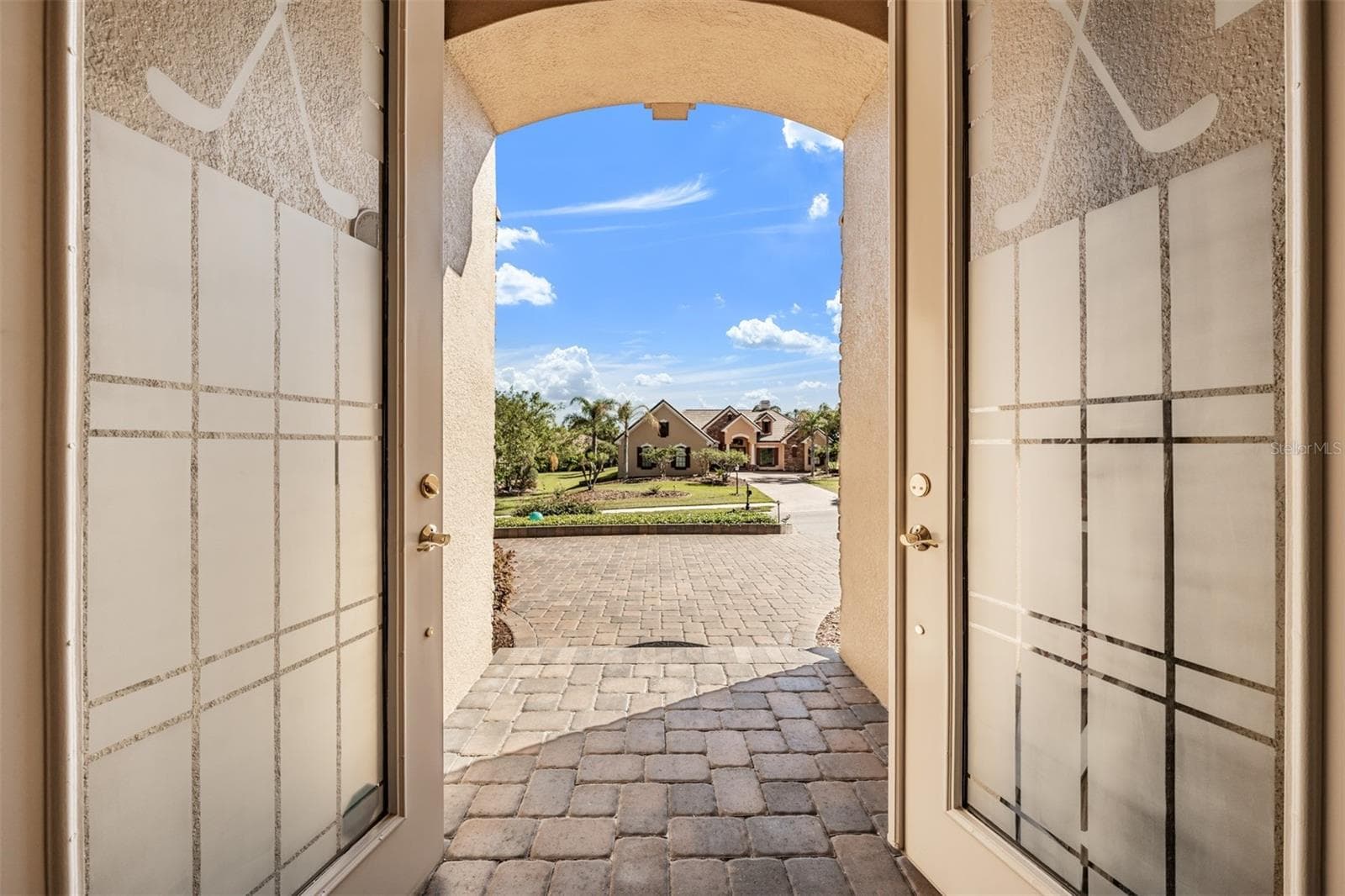 View from front door..Paver drive and walkway - 34115 AMERICANA AVE, DADE CITY