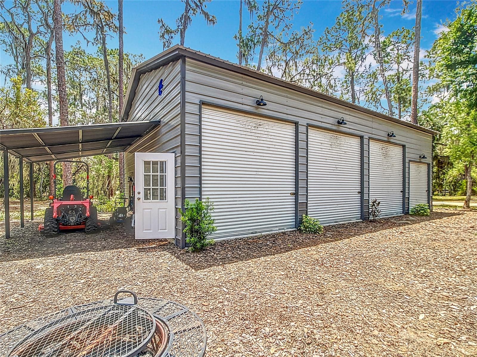Four bay detached metal workshop with electric and lean to - 7374 CIRCLE DR, LADY LAKE