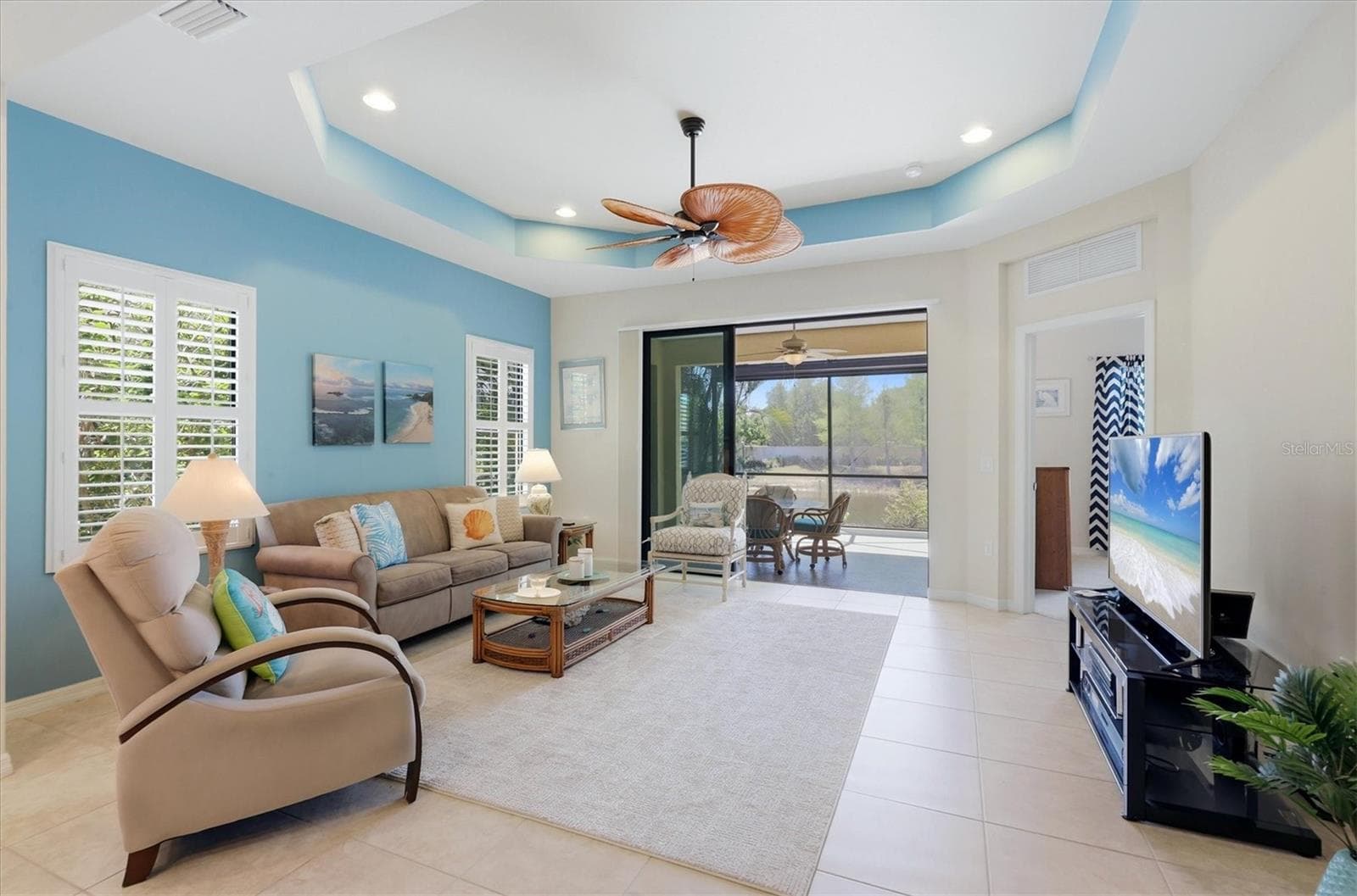 Living Room is complimented with plantation shutters - 1359 BACKSPIN DR, ENGLEWOOD