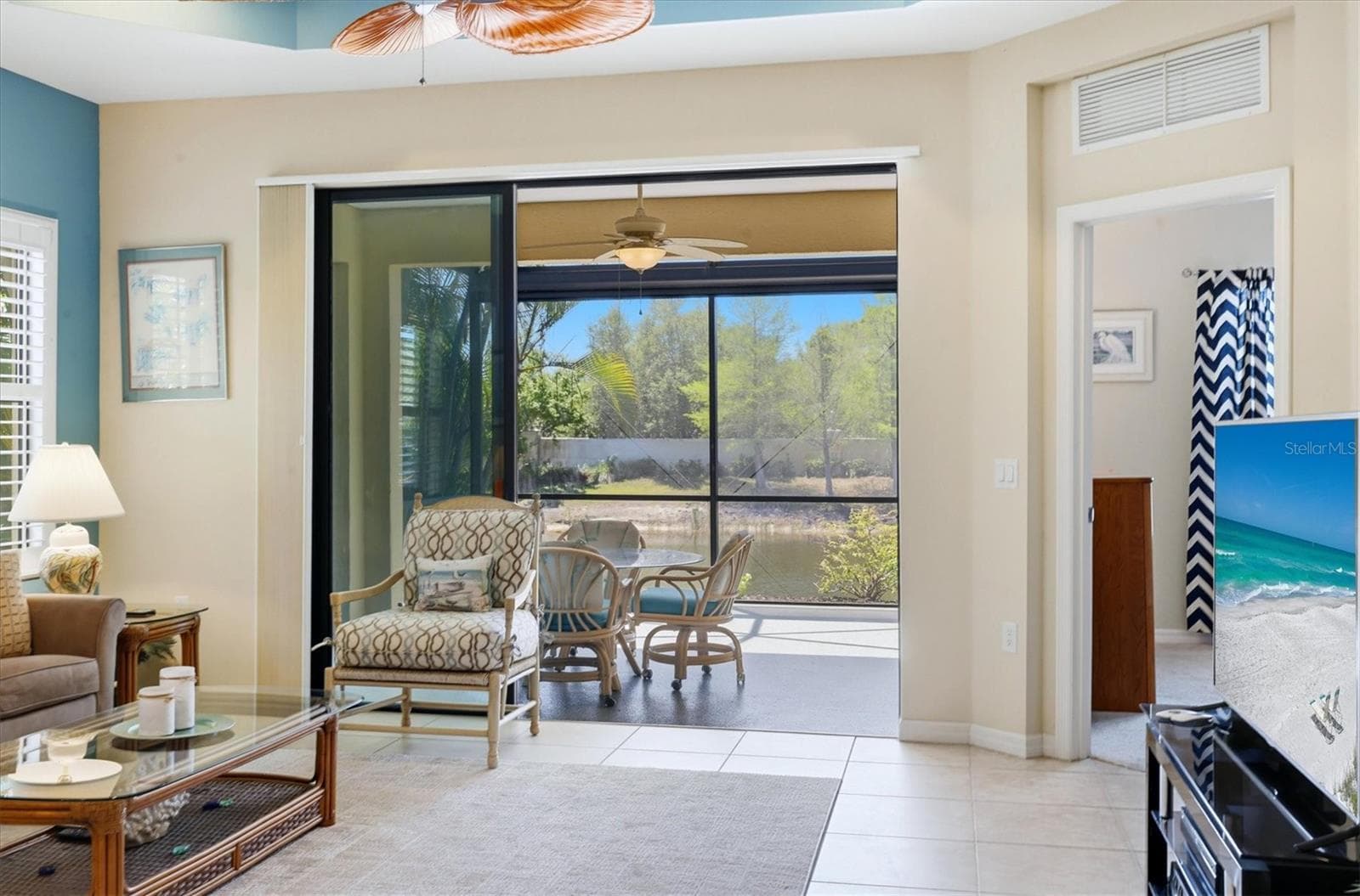 Living Room extends to the Lanai overlooking a lake - 1359 BACKSPIN DR, ENGLEWOOD