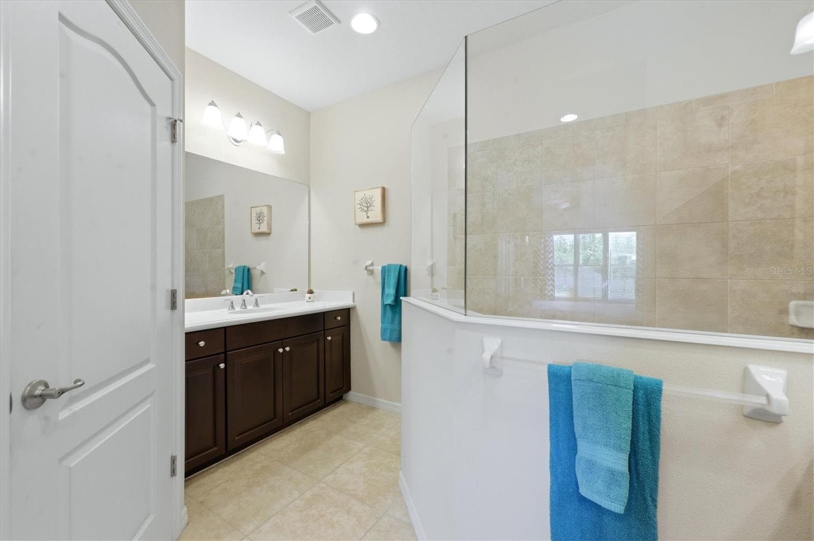 Master Bath features a walk-in shower & dual vanities - 1359 BACKSPIN DR, ENGLEWOOD