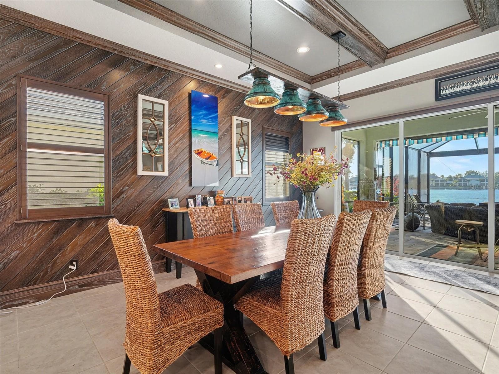 Formal dining area with rich architectural detail, warm natural light, and a welcoming space for gatherings and special occasions. - 1018 OVERLOOK CT, BRADENTON