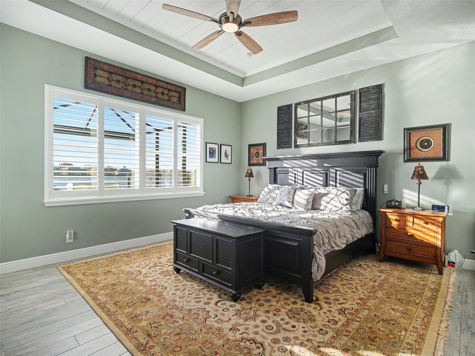 Luxurious primary bedroom with tray ceiling detail, generous natural light, and a peaceful retreat feel. - 1018 OVERLOOK CT, BRADENTON