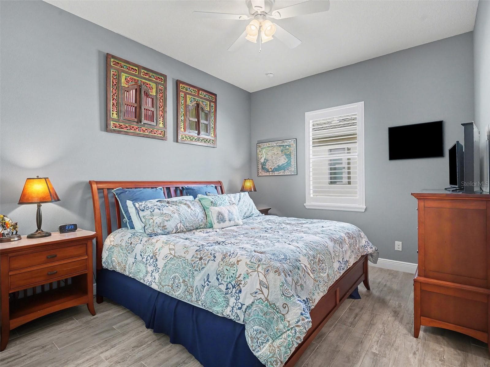 Comfortable guest bedroom with soft natural light, neutral finishes, and a cozy layout for family or visitors. - 1018 OVERLOOK CT, BRADENTON