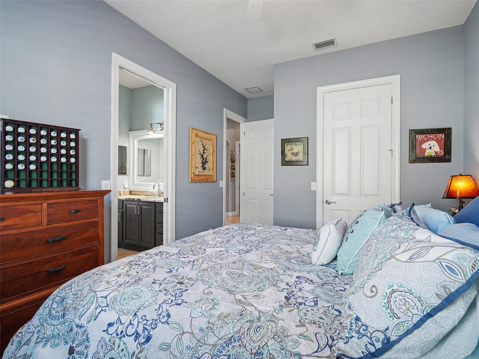 Additional guest bedroom with ceiling fan, generous space, and a light, airy feel. - 1018 OVERLOOK CT, BRADENTON