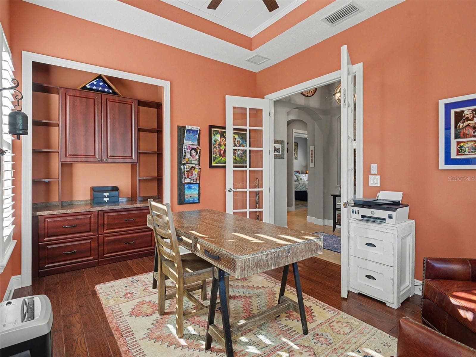 Elegant office or study with custom built ins, warm finishes, and a polished space for productivity or quiet retreat. - 1018 OVERLOOK CT, BRADENTON