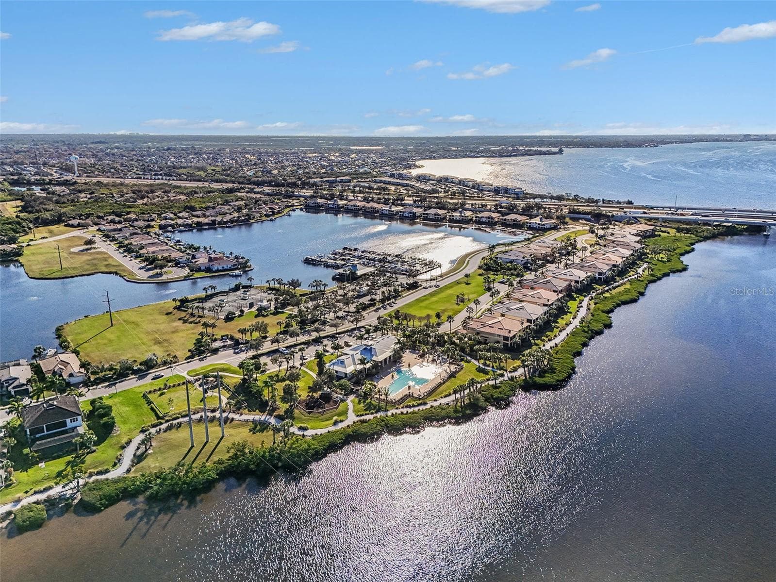 Aerial view of the Manatee River and surrounding waterfront neighborhood, showcasing a prime coastal setting with direct access to the Gulf. - 1018 OVERLOOK CT, BRADENTON