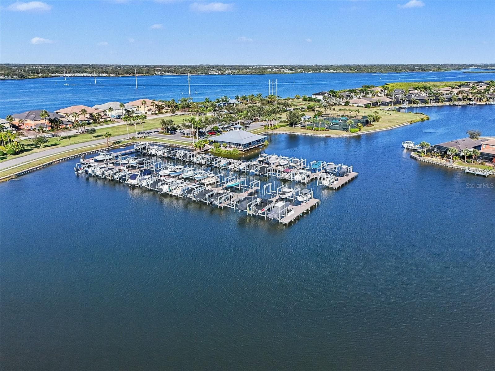 Aerial view of the Manatee River and surrounding waterfront neighborhood, showcasing a prime coastal setting with direct access to the Gulf. - 1018 OVERLOOK CT, BRADENTON