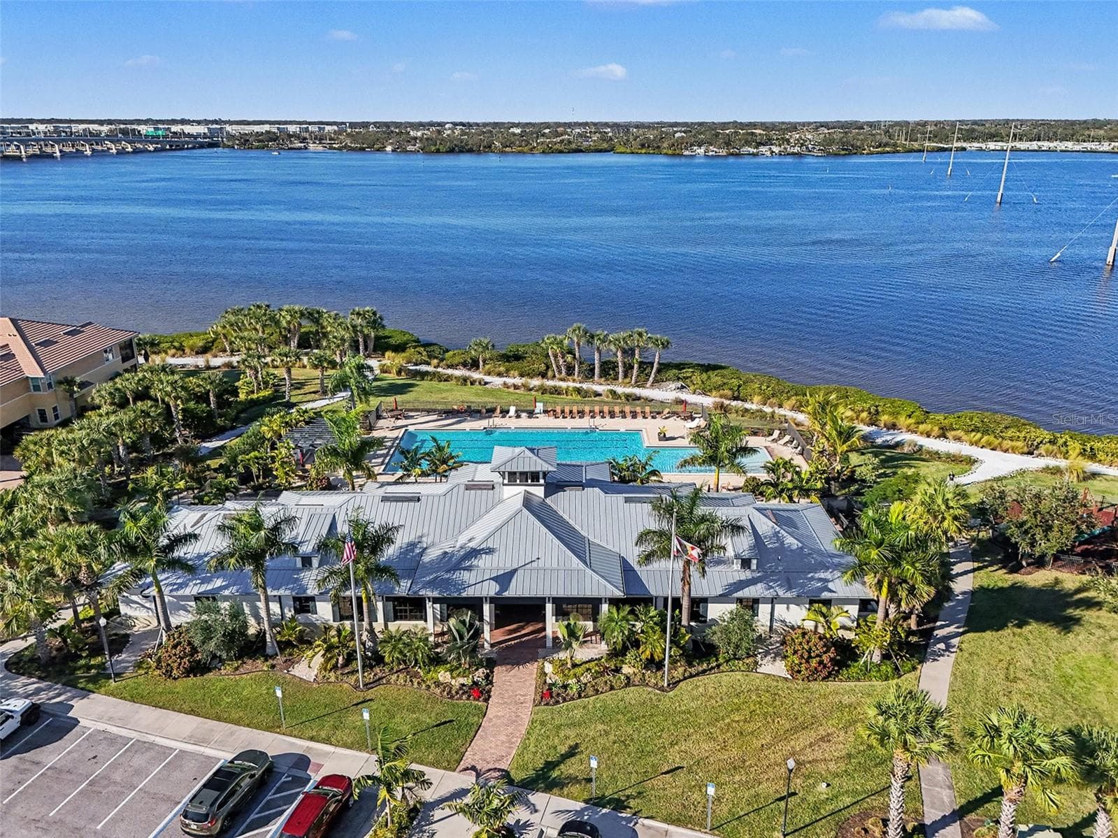 Aerial view of community amenities and waterfront surroundings, showcasing resort style features and scenic water views. - 1018 OVERLOOK CT, BRADENTON