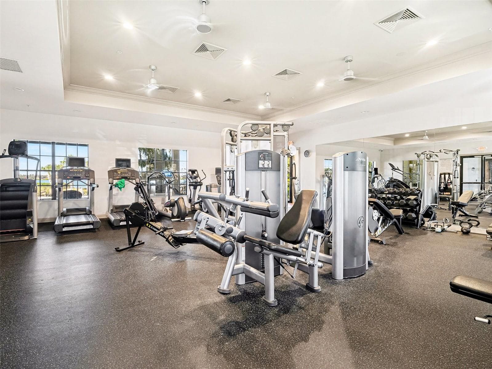 Well equipped community fitness center with modern exercise equipment and plenty of room for daily workouts. - 1018 OVERLOOK CT, BRADENTON