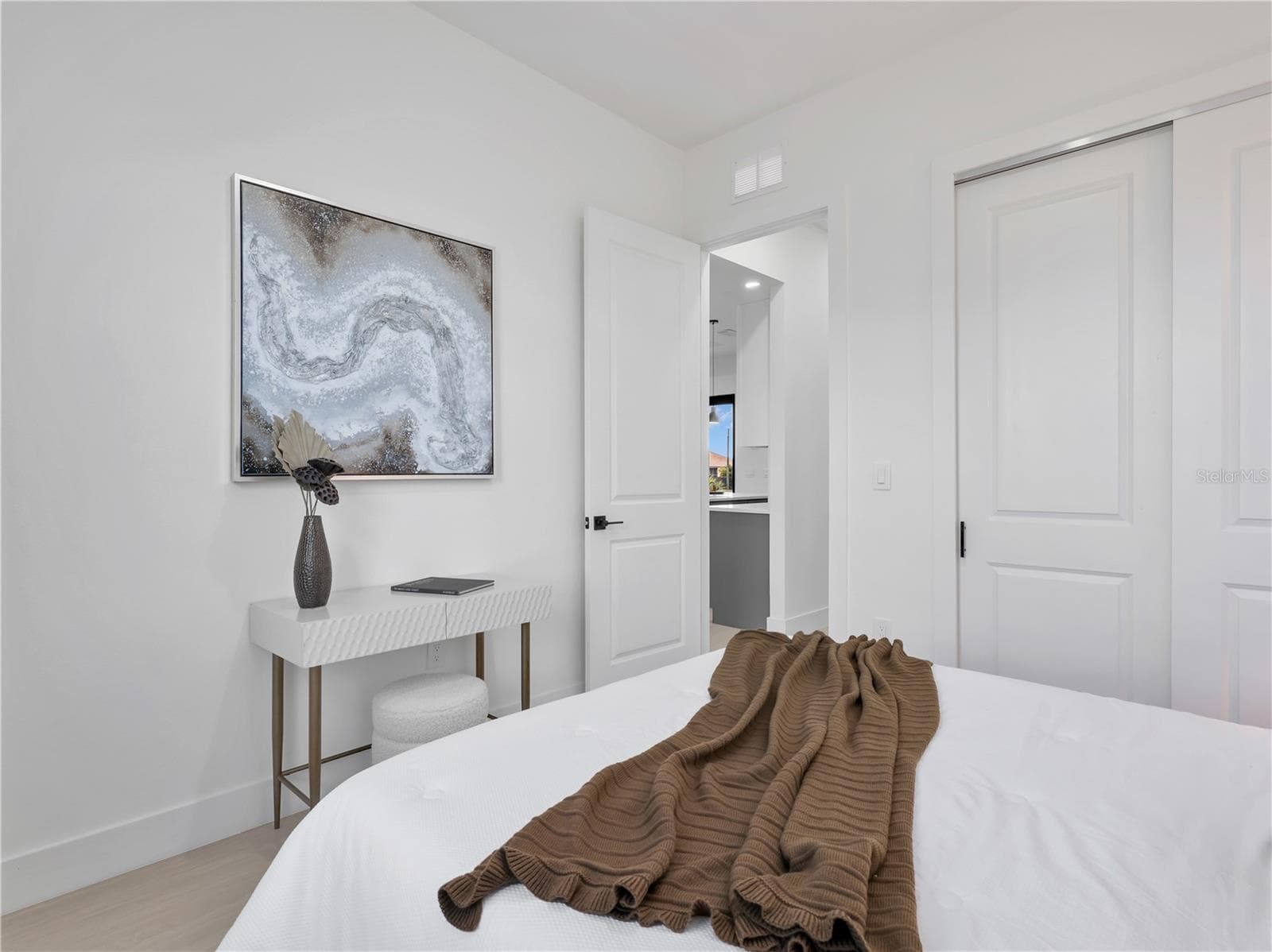 White paneled interior doors with matte black hardware photos used from another listing to show what it would look like with furniture - 1310 NW 11TH TER, CAPE CORAL