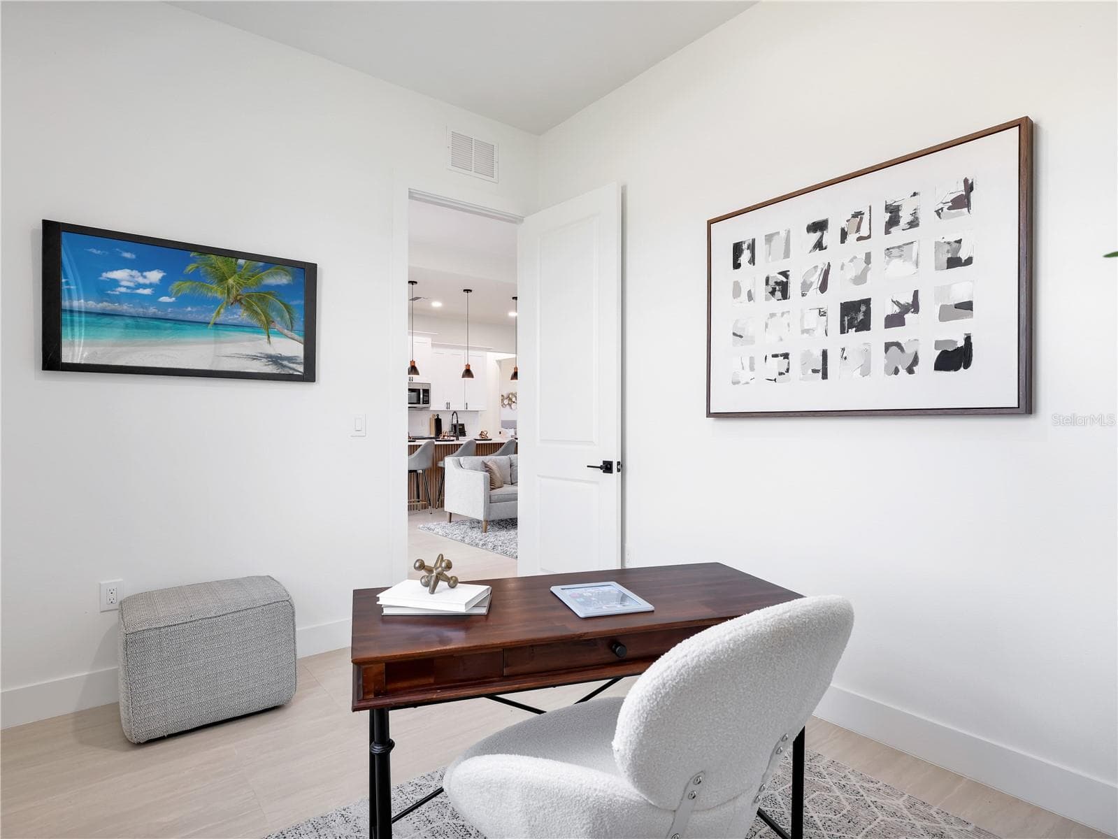 Dedicated interior space featuring light wood-finish flooring and a white color palette photos used from another listing to show what it would look like with furniture - 1310 NW 11TH TER, CAPE CORAL