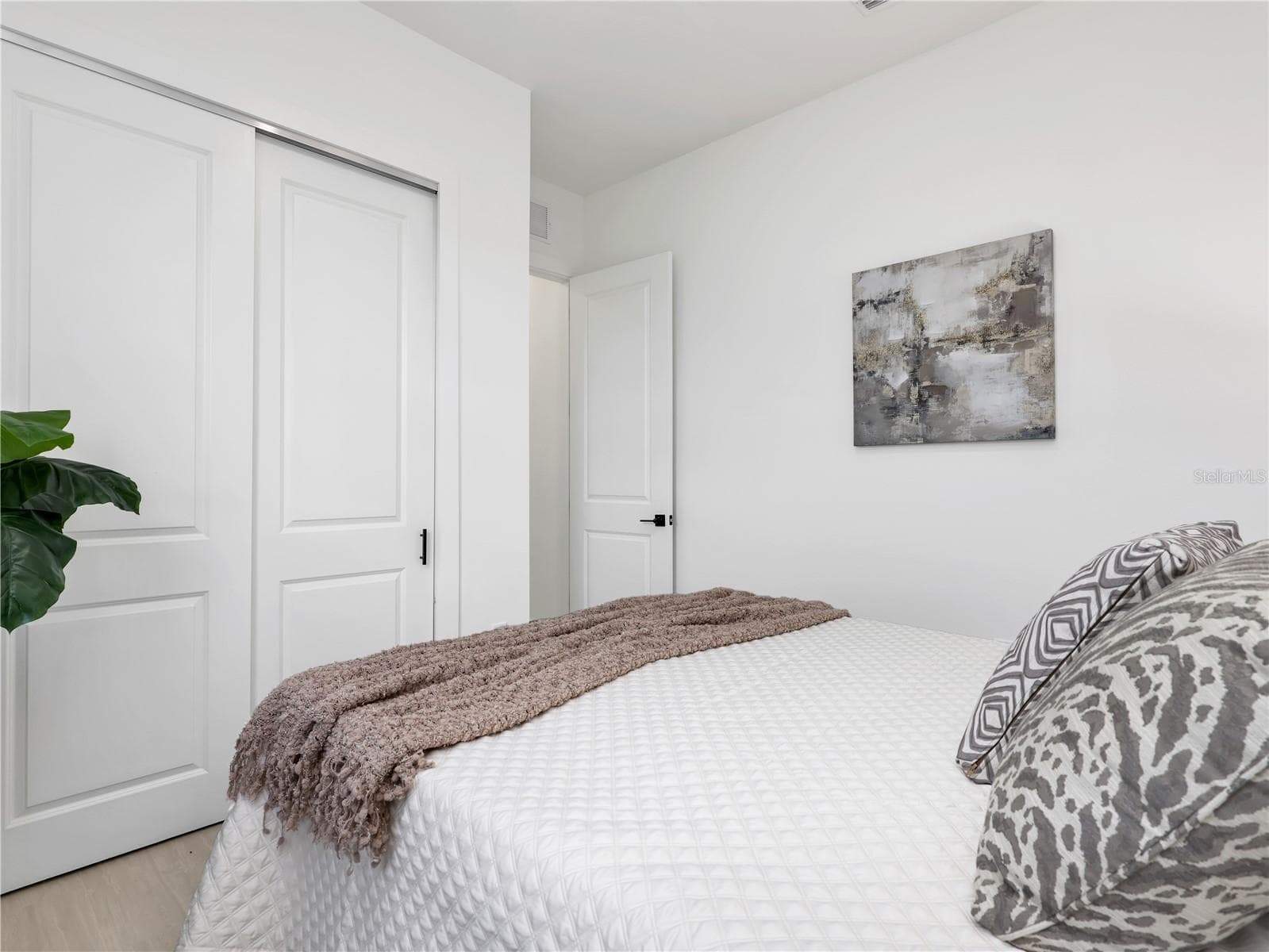 White walls complimenting light wood-finish flooring photos used from another listing to show what it would look like with furniture - 1310 NW 11TH TER, CAPE CORAL