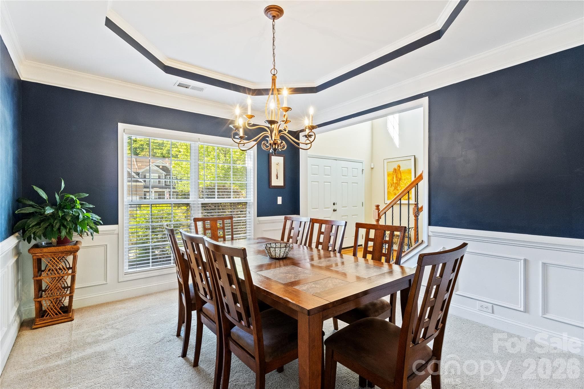 Formal Dining Room with Trey Celing, Pciture Frame, Crown and Chair Rail Molding. - 8458 Mossy Cup Trail, Harrisburg