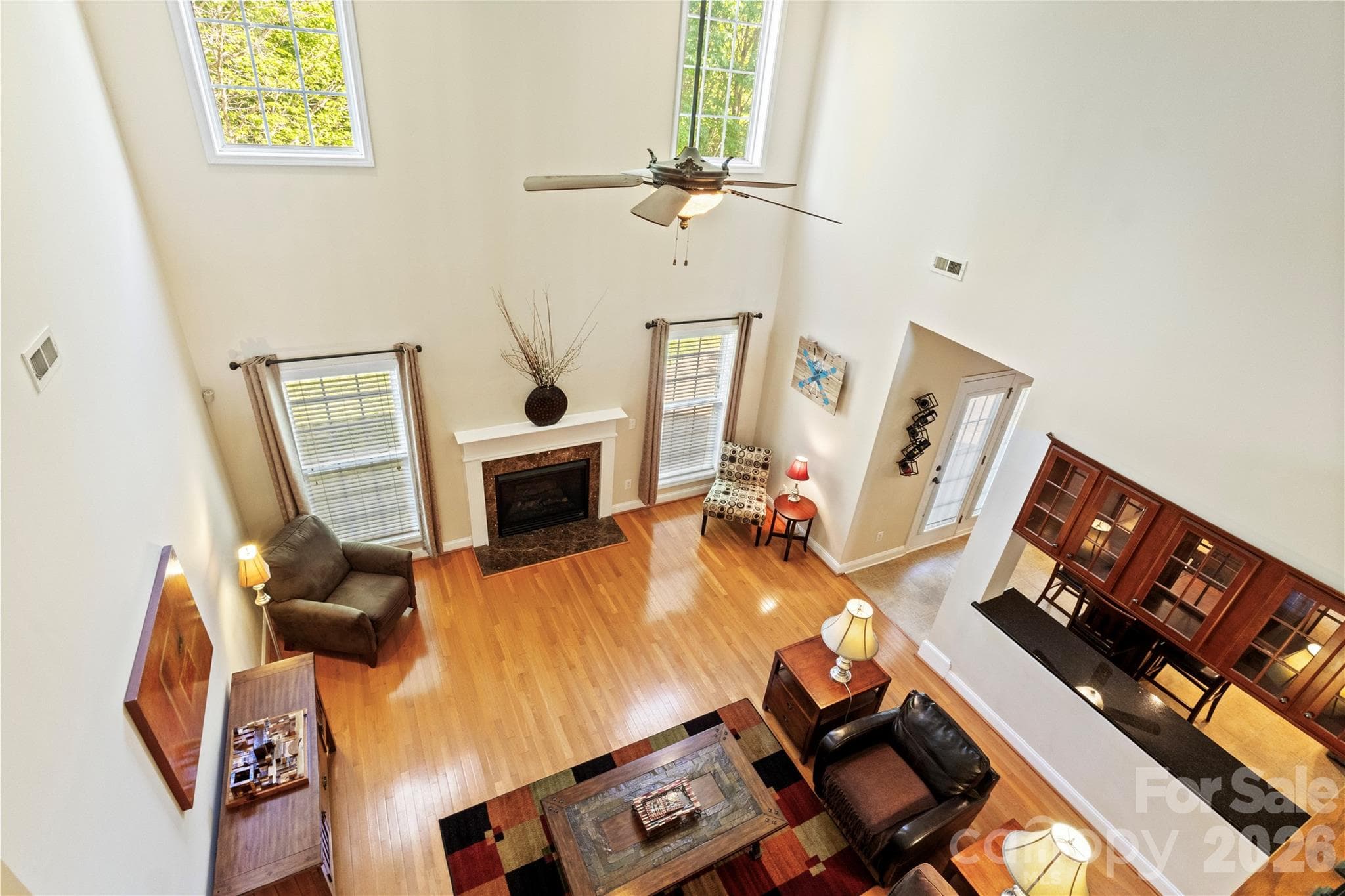 View looking down from the Upstairs Hallway. - 8458 Mossy Cup Trail, Harrisburg