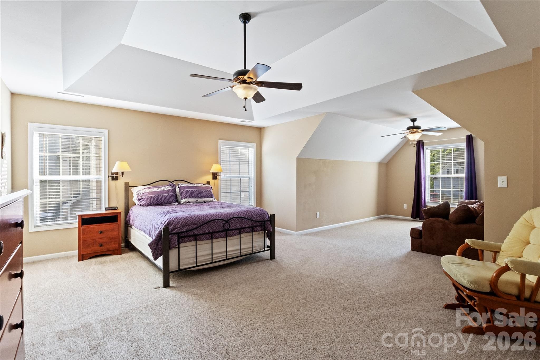Huge Primary Bedroom with Trey Ceiling that opens to Separat Sitting Area with Clipped Ceiling. - 8458 Mossy Cup Trail, Harrisburg