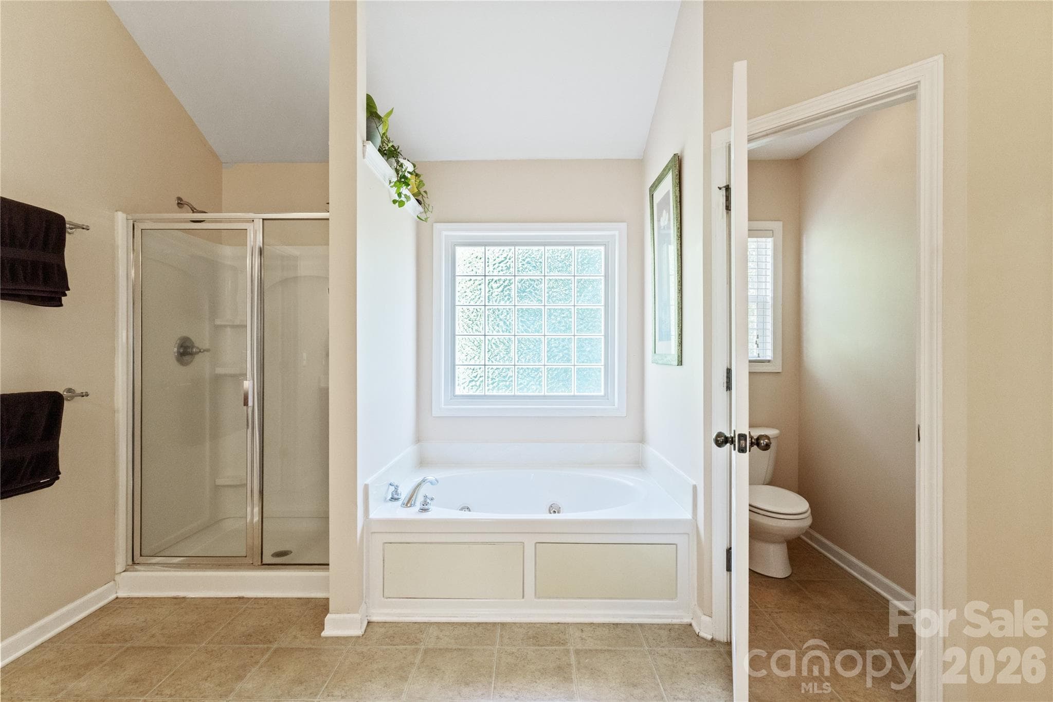 Primary Bathroom with Separate Shower and Garden Tub. - 8458 Mossy Cup Trail, Harrisburg