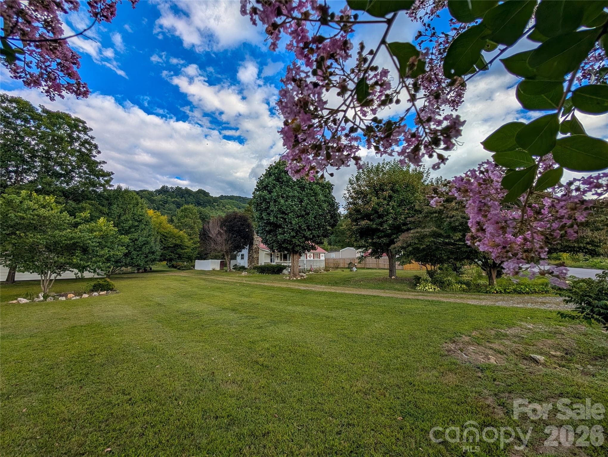 This farmhouse has such a picturesque setting & is situated on 2.74 acres of level usable land! - Burnsville