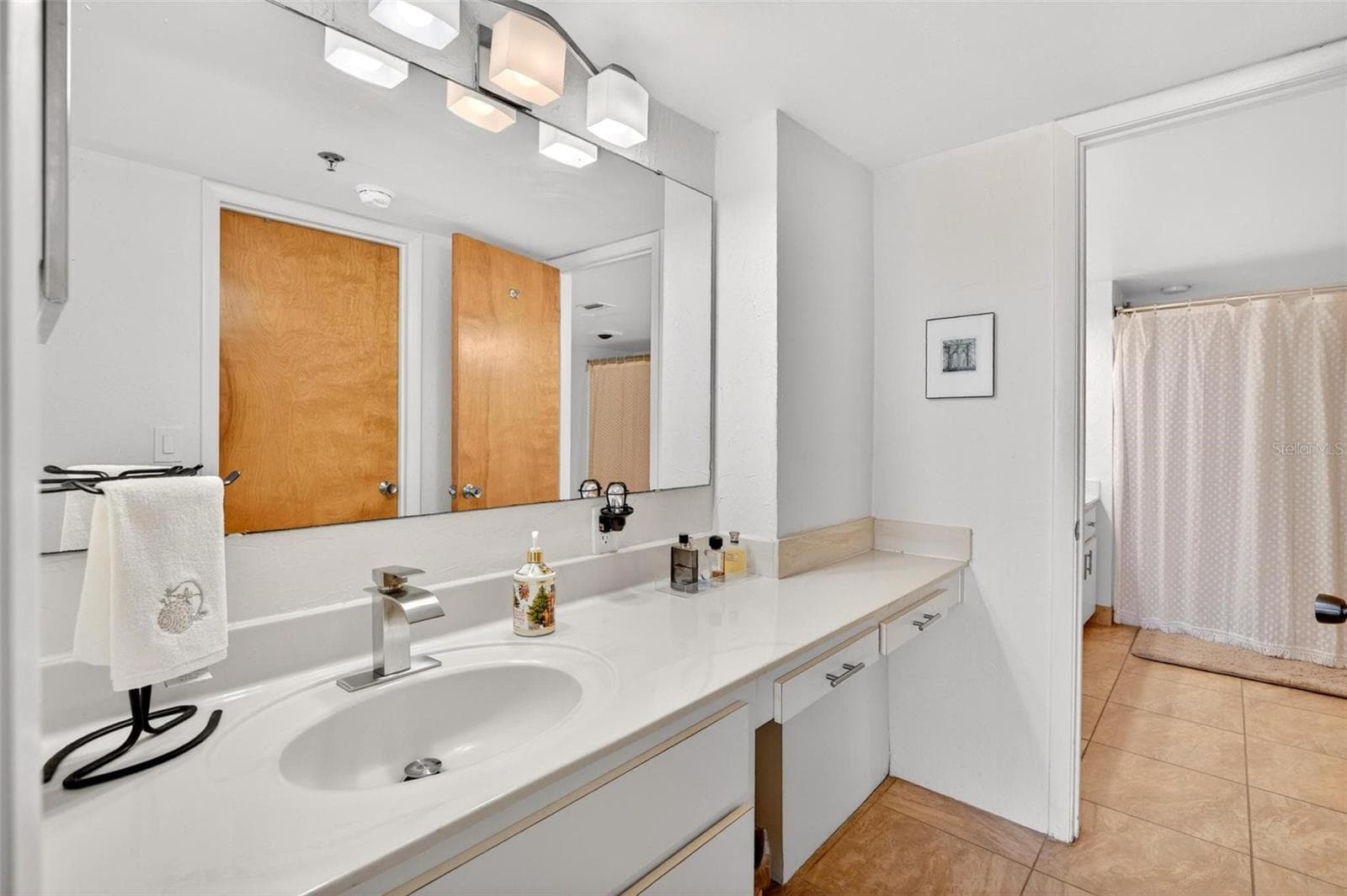 Primary bath with separate counter space and sinks - 3743 S ATLANTIC AVE #7A00, DAYTONA BEACH