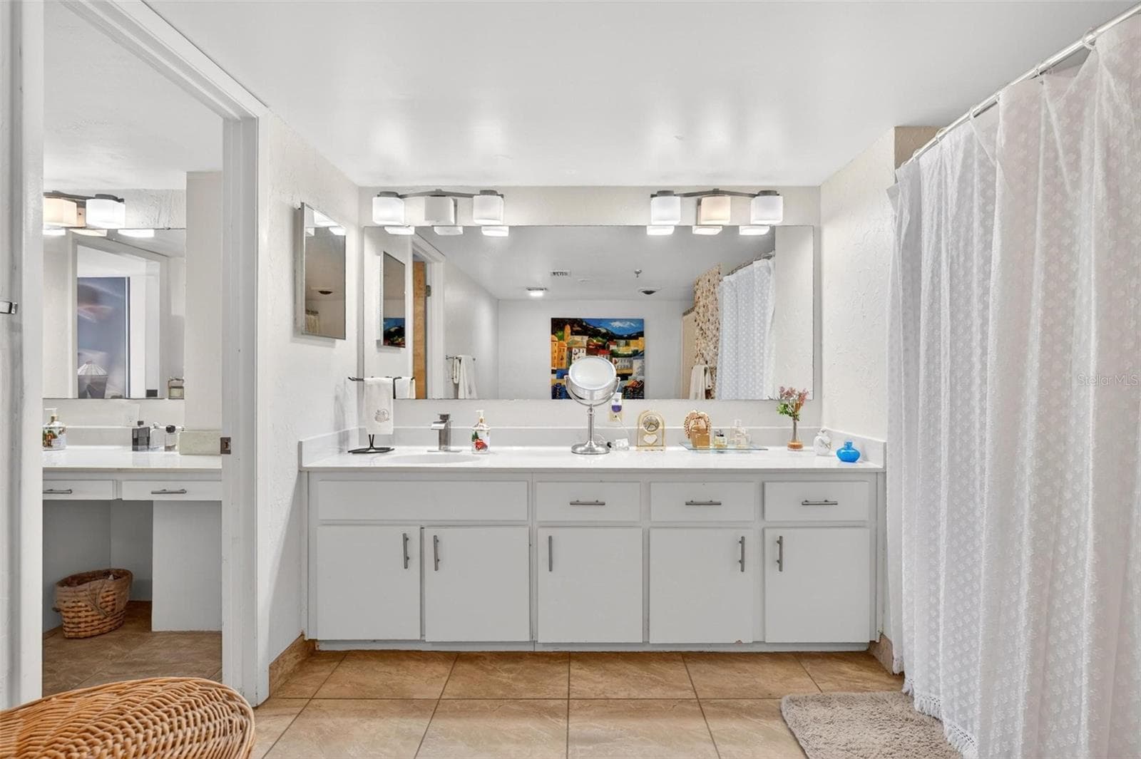 Primary bath with separate counter space and sinks - 3743 S ATLANTIC AVE #7A00, DAYTONA BEACH