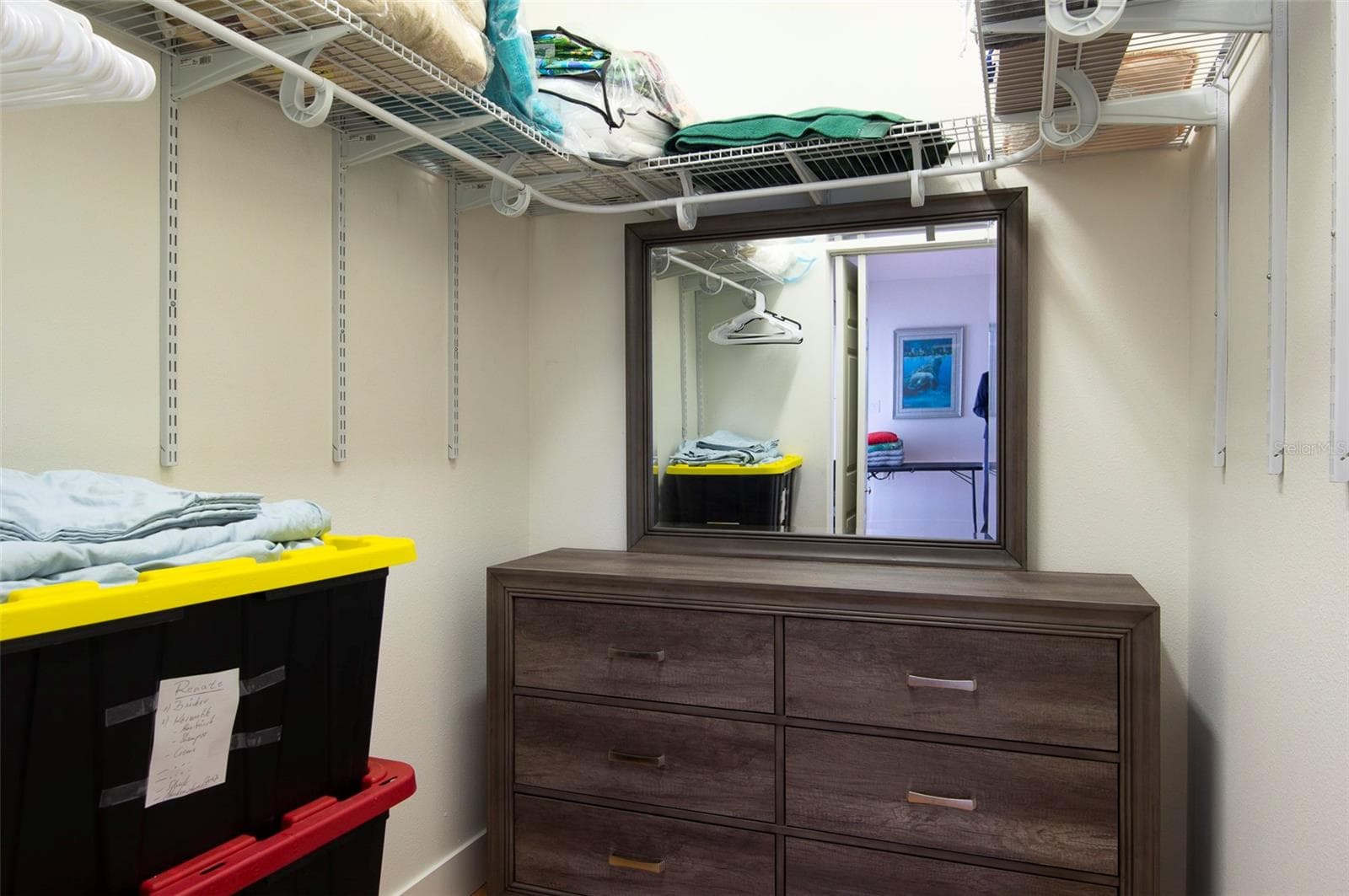 The master bedroom features a spacious walk-in closet - 11855 4TH ST E, TREASURE ISLAND