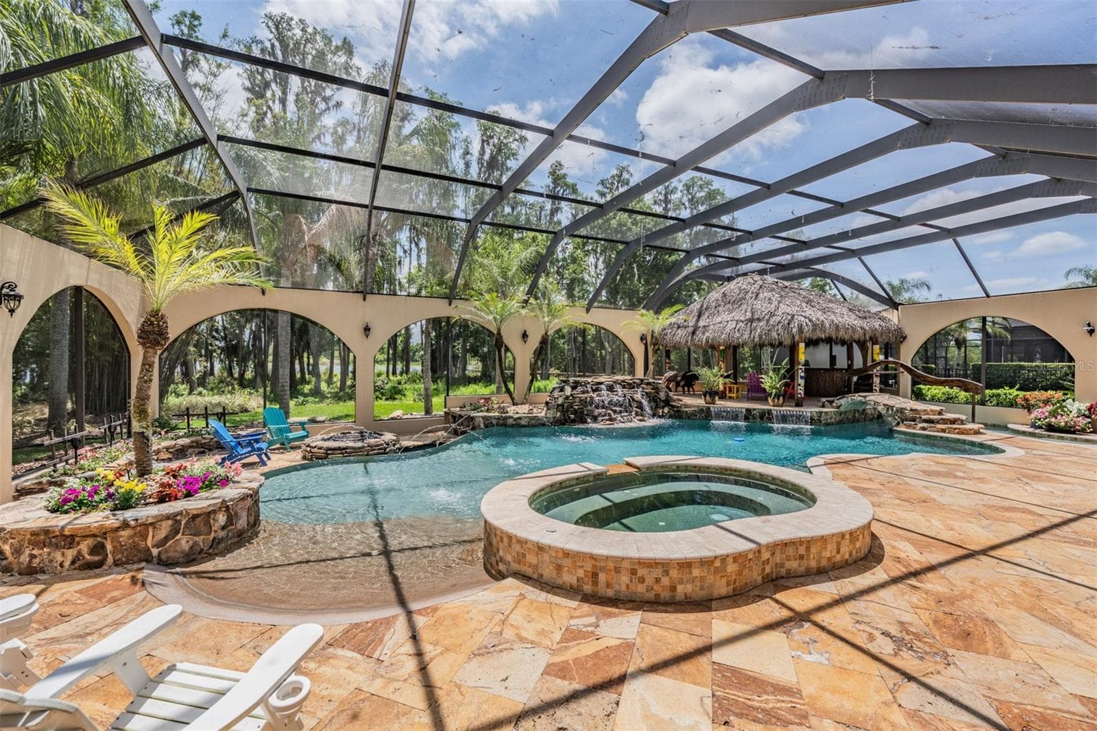 Private Pool Oasis with it's own fountains, waterfalls, spa, Tiki Hut and beach entry pool - 21246 QUIET HAVEN CT, LAND O LAKES