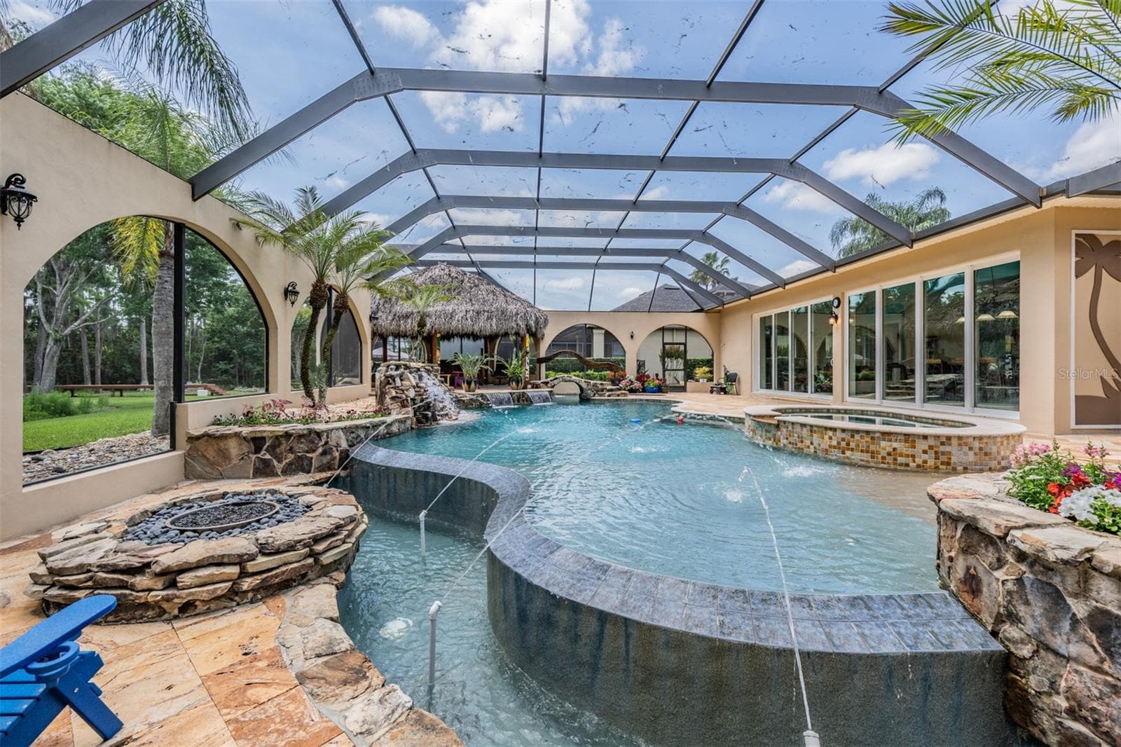 Private Pool Oasis with it's own fountains, waterfalls, spa, Tiki Hut and beach entry pool - 21246 QUIET HAVEN CT, LAND O LAKES