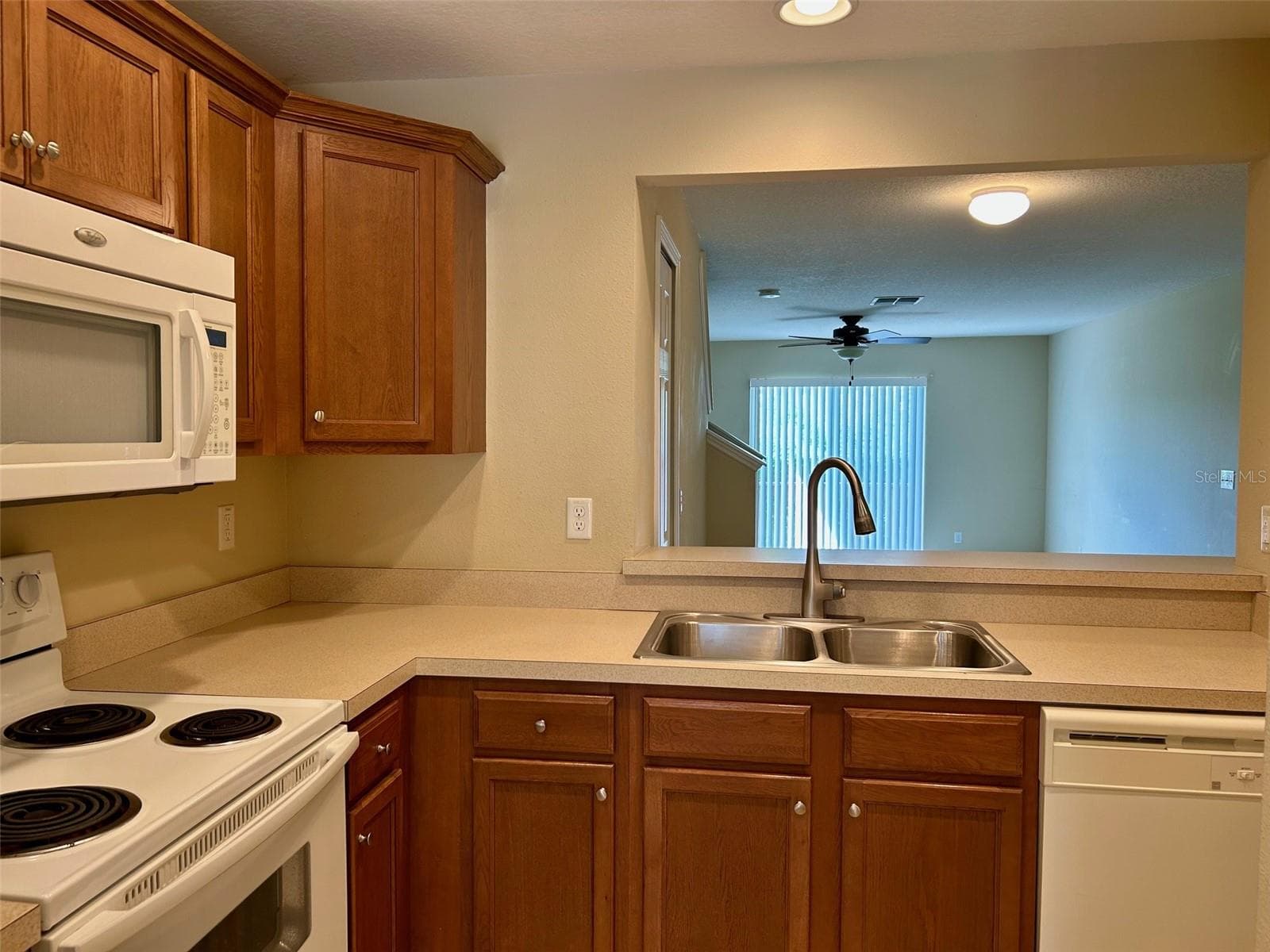 Kitchen With Pass Through To Dining Area - 2078 SUN DOWN DR, CLEARWATER
