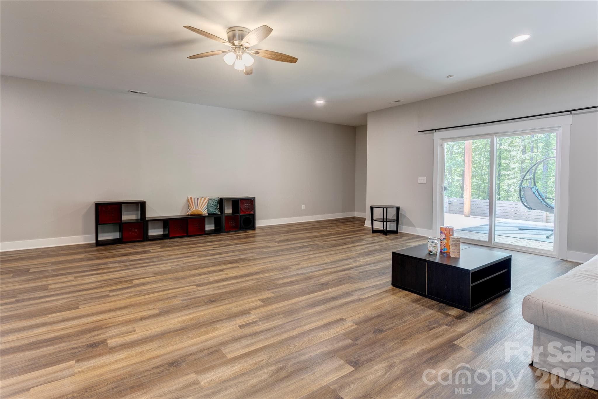 Basement Family room looking out to patio - Charlotte